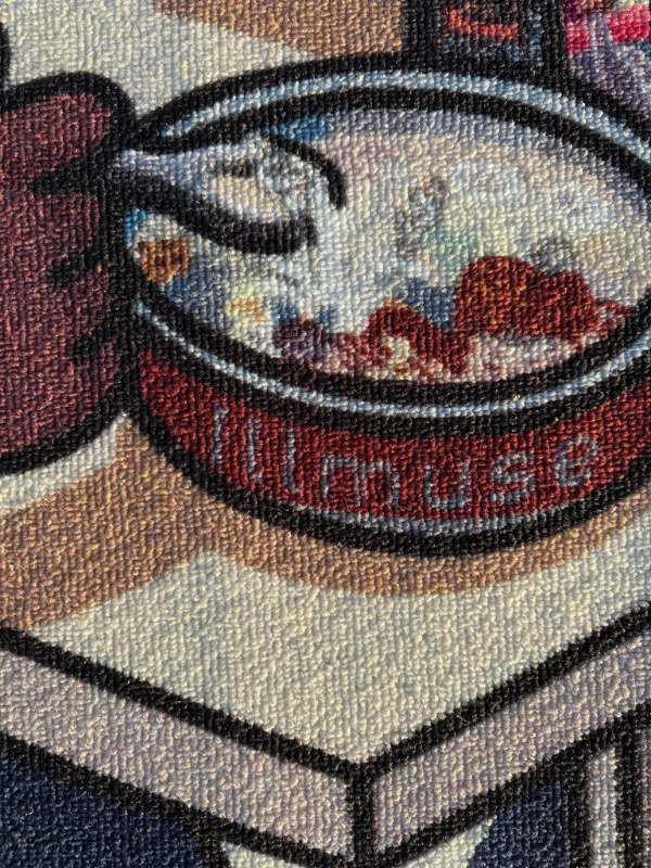 MM..FOOD rug, bowl close-up featuring ILL MUSE branding, subtle cartoon/pixel look