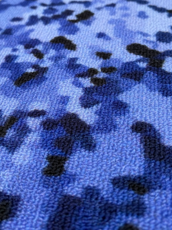 JEFFERY rug, dress detail close-up in pixel-style design, woven texture visible