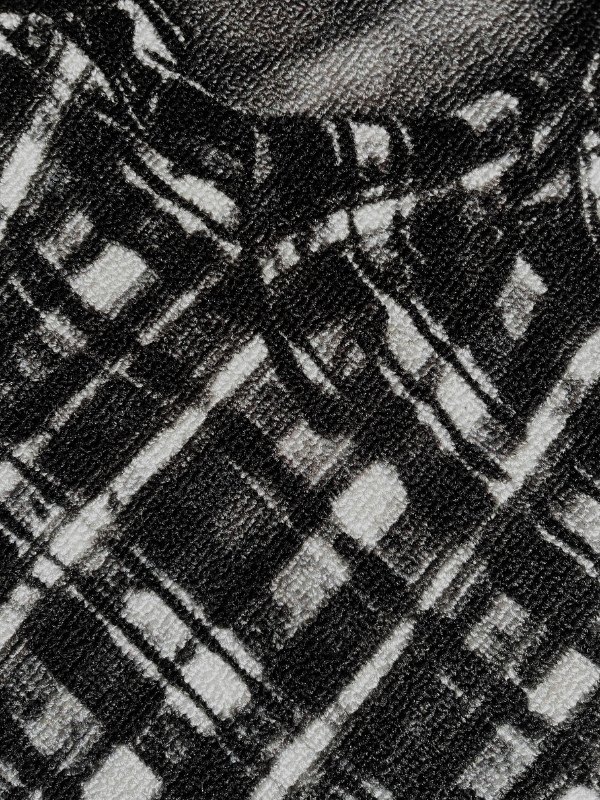 LIVE.LOVE.A$AP rug close-up showing the collar and black-and-white shirt from the cover, woven texture visible
